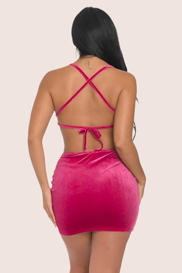 woman wearing pink velour mini dress