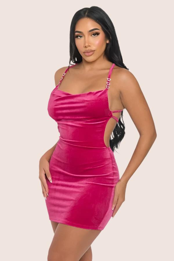 woman wearing pink velour mini dress