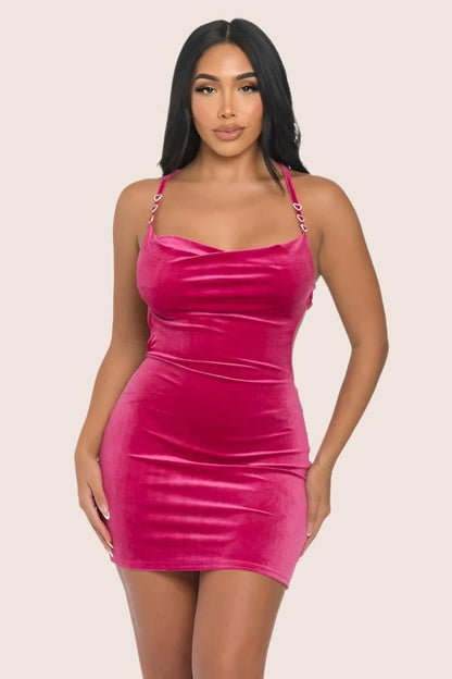 woman wearing pink velour mini dress